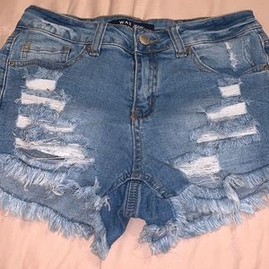 Distressed denim shorts with stretch